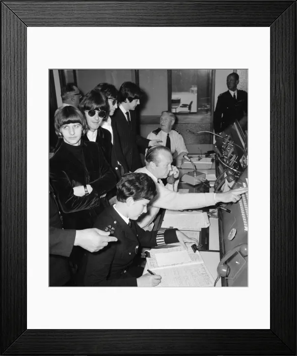 Framed Print : A bored looking Ringo Starr listens as the Beatles are shown around the new police Framed Print : A bored looking Ringo Starr listens as the Beatles are shown around the new police