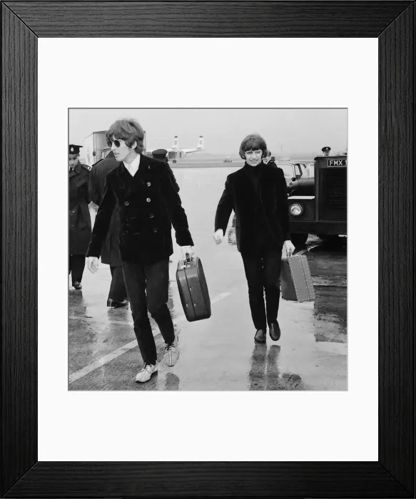 Framed Print : George Harrison and Ringo Starr leave a rainsoaked London Airport for Chicago via Boston
