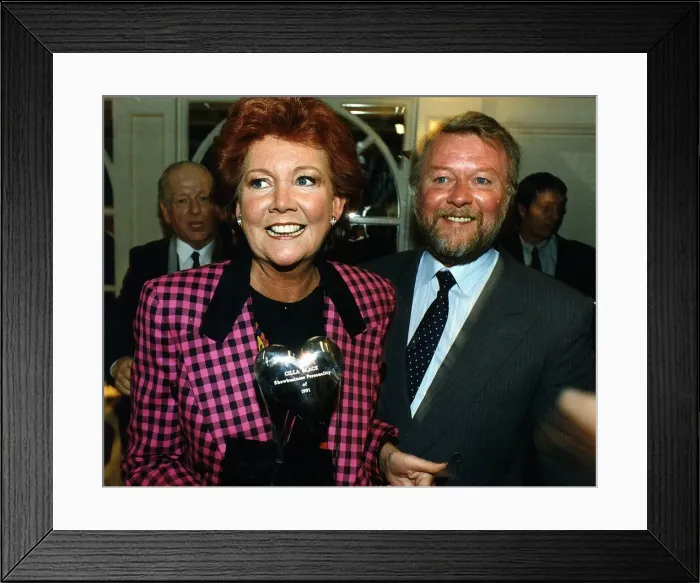 Framed Print : Cilla Black, dressed in a black and pink chequered jacket Framed Print : Cilla Black, dressed in a black and pink chequered jacket