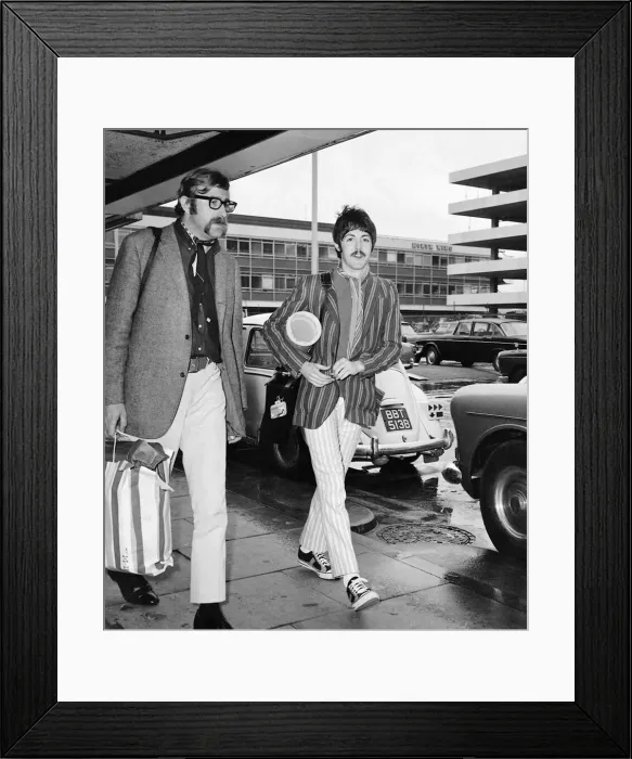 Framed Print : Paul McCartney, with Beatles assistant Mal Evans, returns to London Airport Framed Print : Paul McCartney, with Beatles assistant Mal Evans, returns to London Airport