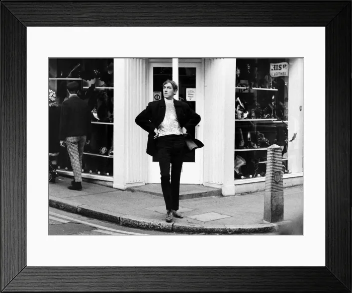 Framed Print : Comedian Peter Cook stands in Carnaby Steet during the filming of sketch for