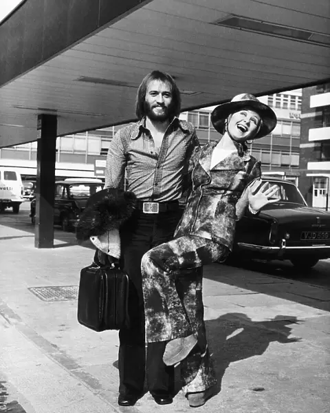 Lulu singer with her husband Maurice Gibb of the pop group the Bee Gees arrive at London