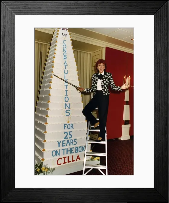 Framed Print : Cilla Black on a step ladder about to cut her cake with a sword celebrating her 25 Framed Print : Cilla Black on a step ladder about to cut her cake with a sword celebrating her 25