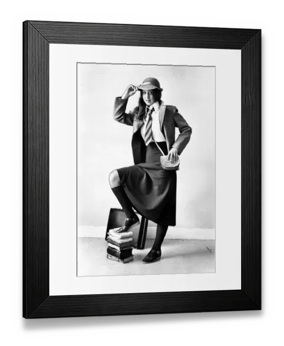 Framed Print : A schoolgirl posing in her smart school uniform