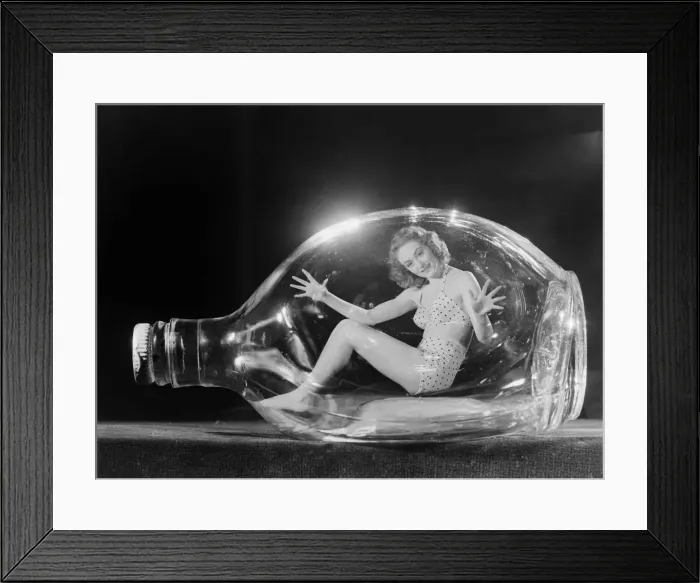 Framed Print : Maureen O Dea Windmill Theatre Girl, photographed in glass bottle