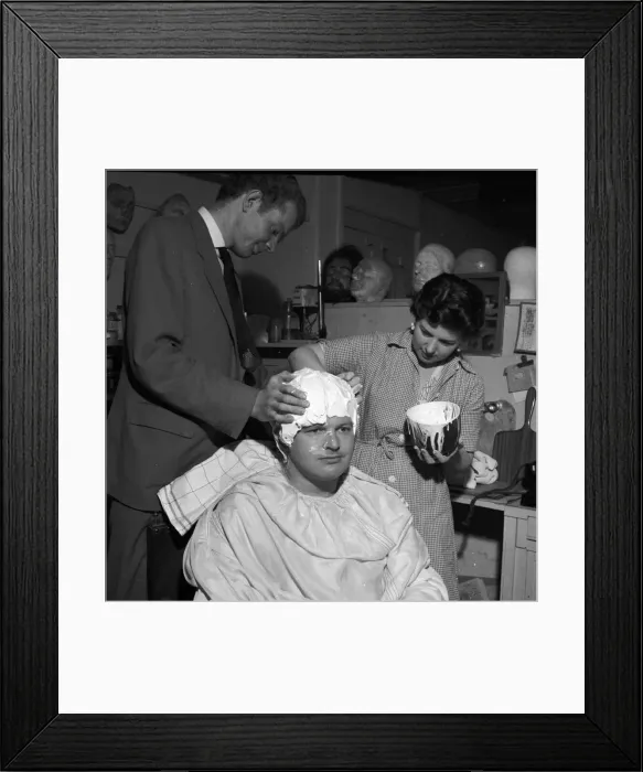 Framed Print : Comedian Benny Hill having a plaster cast of his skull made Framed Print : Comedian Benny Hill having a plaster cast of his skull made