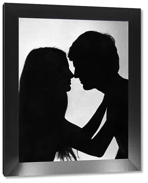 Love and Romance silhouette of a couple about to embrace - kiss Feburary 1979