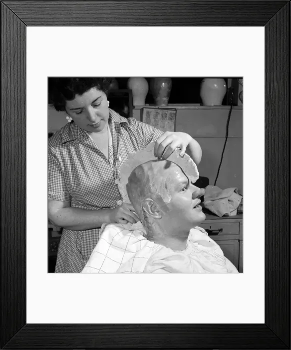 Framed Print : Comedian Benny Hill having a plaster cast of his skull made Framed Print : Comedian Benny Hill having a plaster cast of his skull made