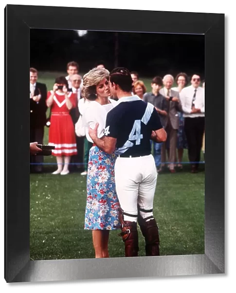 Prince Charles, Prince of Wales and Princess Diana, Princess of Wales kiss as they attend