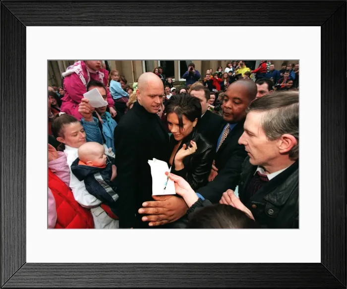 Framed Print : Posh Spice being mobbed by fans as she leaves One Devonshire Place Glasgow Framed Print : Posh Spice being mobbed by fans as she leaves One Devonshire Place Glasgow
