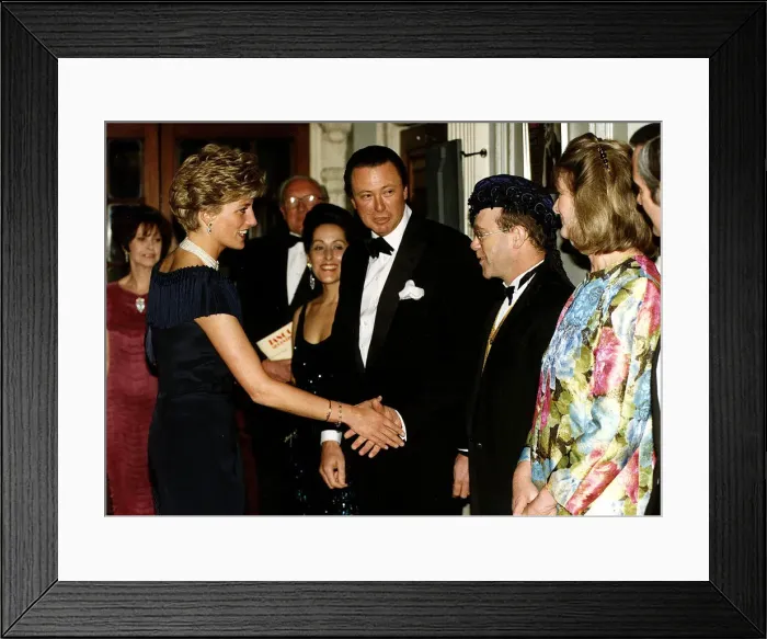 Framed Print : Diana, Princess of Wales is greeted by singer Elton John for a charity performance of Framed Print : Diana, Princess of Wales is greeted by singer Elton John for a charity performance of