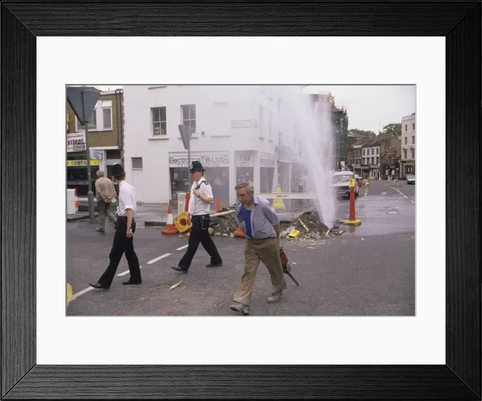 Framed Print : Alisdair MacDonalds 1988 award winning picture of a watermain in Pimlico after a
