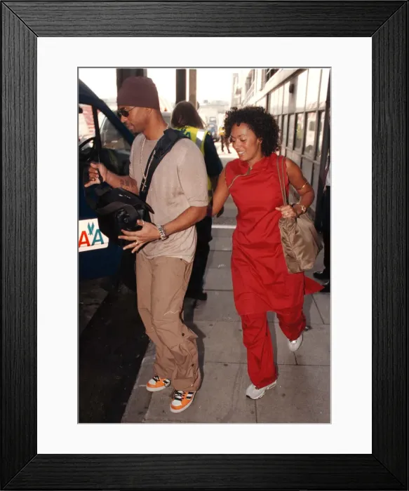 Framed Print : Spice Girl Mel B and husband Jimmy Gulzar Sep 1998 Newly weds leaving Heathrow for