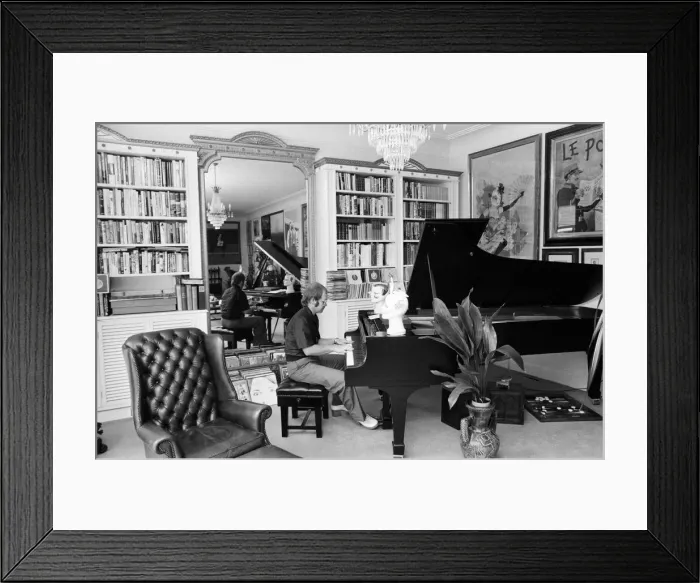 Framed Print : Elton John in his new £50, 000 mansion in Camberley, Surrey playing his piano Framed Print : Elton John in his new £50, 000 mansion in Camberley, Surrey playing his piano
