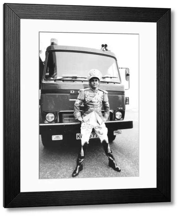 Framed Print : Elton John pop singer on the start of his new British Tour here showing off one of