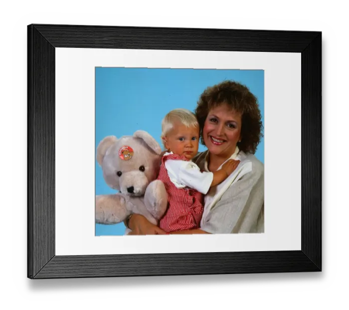 Framed Print : Scottish singer and actress Barbara Dickson holding her son and a teddy bear