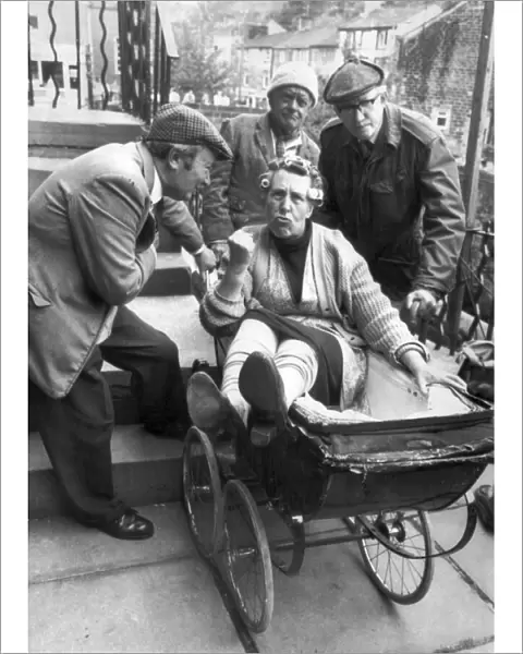 Nora Batty (played by Kathy Staff) gets a ride in the pram from Norman Clegg