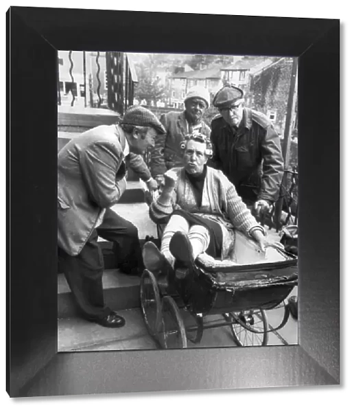 Nora Batty (played by Kathy Staff) gets a ride in the pram from Norman Clegg