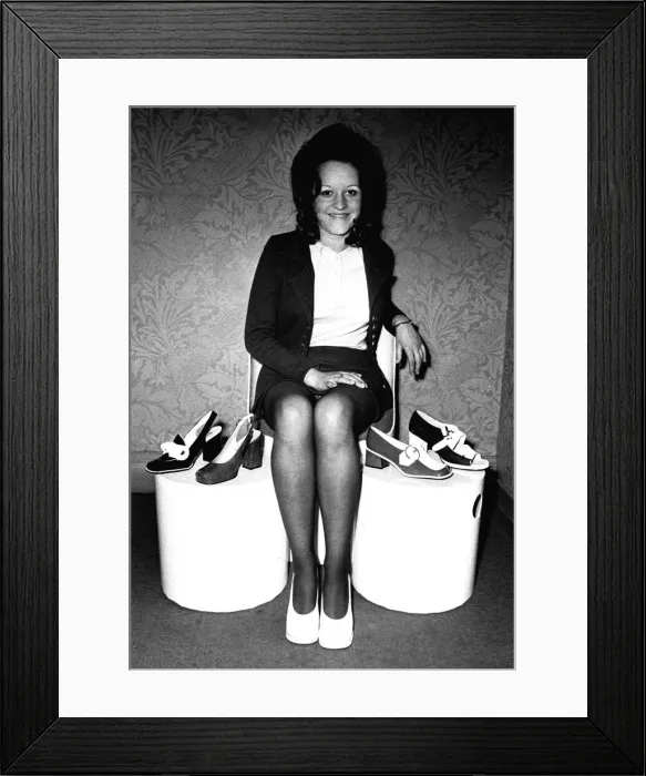 Framed Print : A model showing off some shoes from July 1970