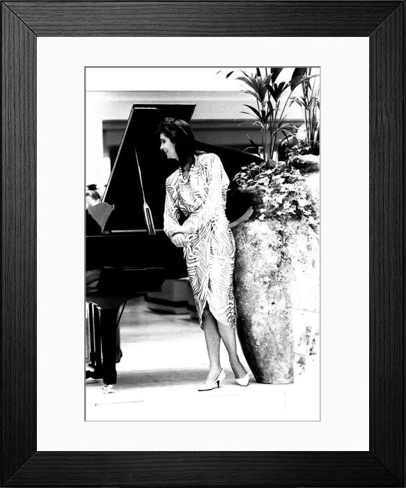 Framed Print : A model wearing a split skirt dress in March 1987 Framed Print : A model wearing a split skirt dress in March 1987