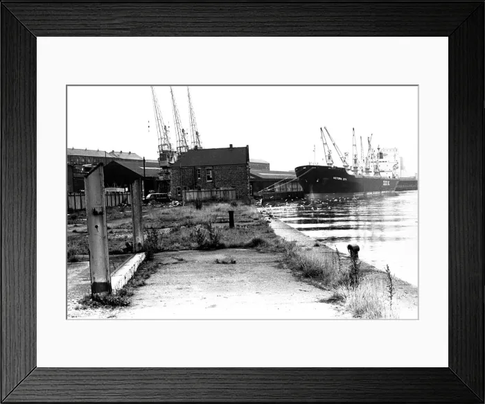 Framed Print : Dereliction along the quayside in Newcastle. The Victoria City ship moored Framed Print : Dereliction along the quayside in Newcastle. The Victoria City ship moored
