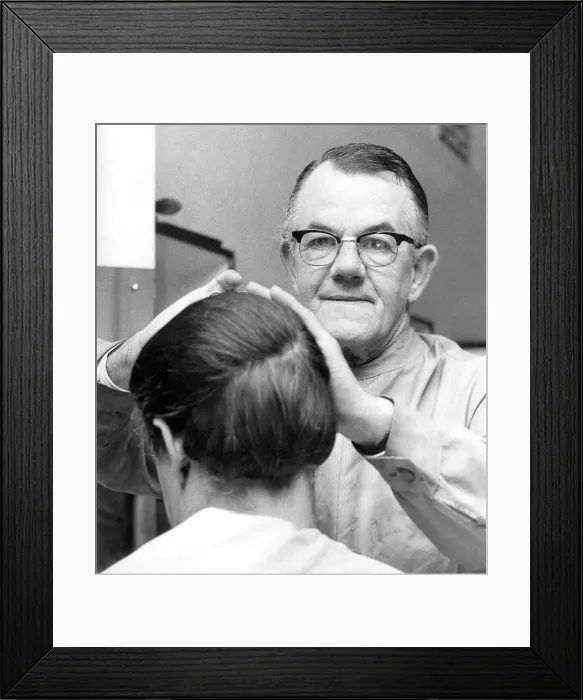 Framed Print : Barber Mr. Fisher hard at work within Bainbridges hairdressing salon in August 1969 Framed Print : Barber Mr. Fisher hard at work within Bainbridges hairdressing salon in August 1969