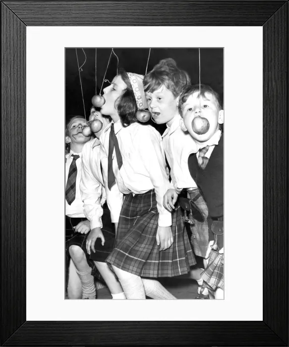 Framed Print : Catching an apple on a string may not be the easiest of jobs Framed Print : Catching an apple on a string may not be the easiest of jobs