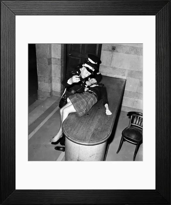 Framed Print : An over-excited female Beatles fan is attended to at a Sheffield concert by the St Johns Framed Print : An over-excited female Beatles fan is attended to at a Sheffield concert by the St Johns