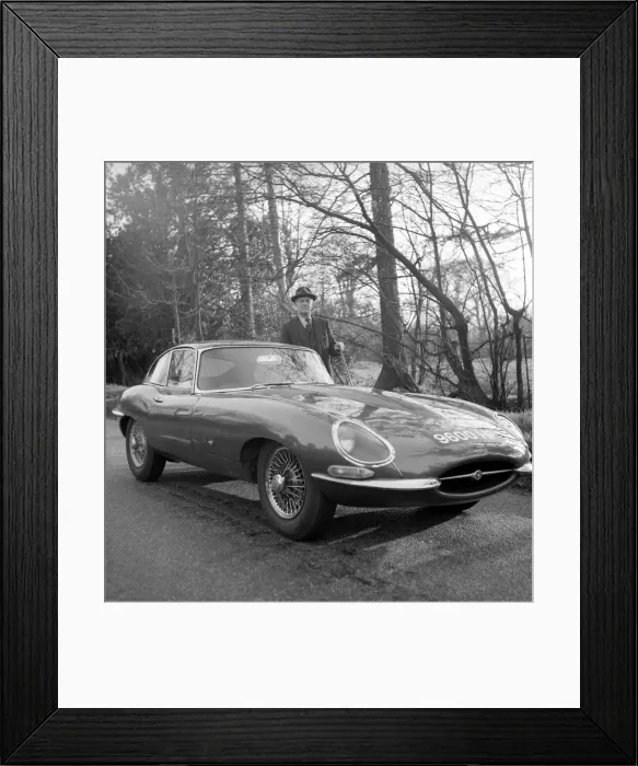 Framed Print : Daily Herald motor racing correspondent HThomas H Wisdom standing beside a new Jaguar Framed Print : Daily Herald motor racing correspondent HThomas H Wisdom standing beside a new Jaguar