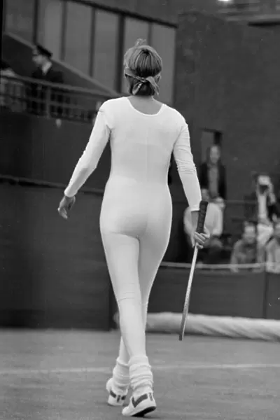 American tennis player Anne White in action wearing her white skin tight catsuit during