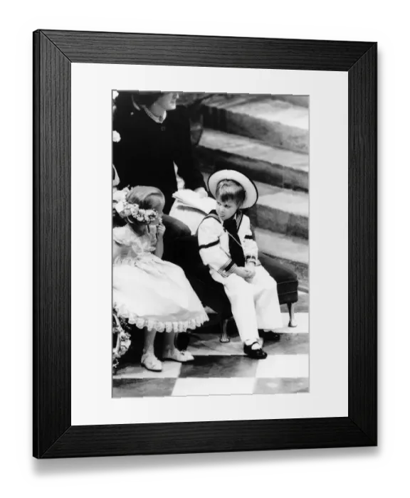 Framed Print : Bored Prince William sticks a tongue out at Laura Fellowes at the wedding of Prince Framed Print : Bored Prince William sticks a tongue out at Laura Fellowes at the wedding of Prince
