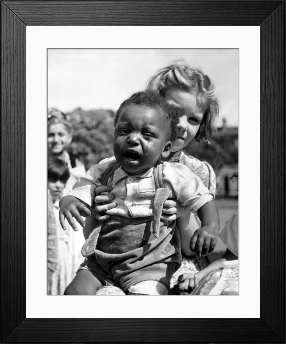 Framed Print : A Baby crying being held by a young girl at a festival tea party July 1953 Framed Print : A Baby crying being held by a young girl at a festival tea party July 1953