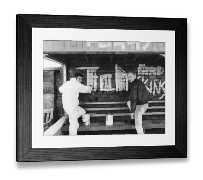 Framed Print : Teenagers Alan Quinnin and Bill Hutchinson start the clean-up after vandals wrecked havoc