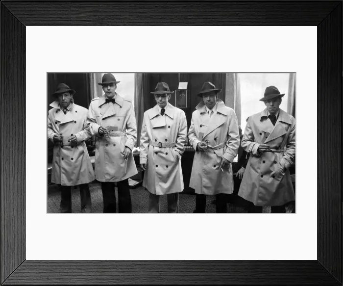 Framed Print : Humphrey Bogart look a like competition. Competition entrants in their Bogart raincoats