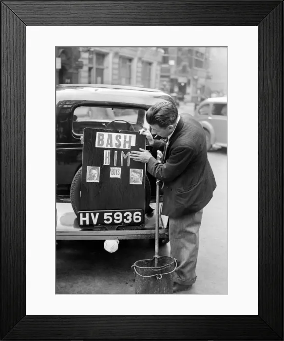 Framed Print : A driver pastes a picture of Hitler and the words Bash Him on to the boot of his car Framed Print : A driver pastes a picture of Hitler and the words Bash Him on to the boot of his car