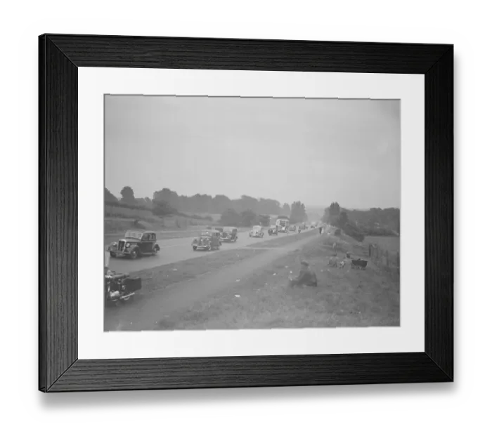 Framed Print : Picnickers sit on the verge watching the traffic on the Sidcup by-pass Framed Print : Picnickers sit on the verge watching the traffic on the Sidcup by-pass