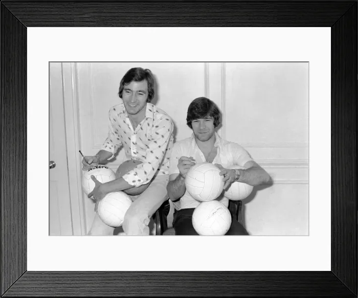 Framed Print : England team at hotel: Alan Hudson left and Malcolm MacDonald sign match footballs Framed Print : England team at hotel: Alan Hudson left and Malcolm MacDonald sign match footballs
