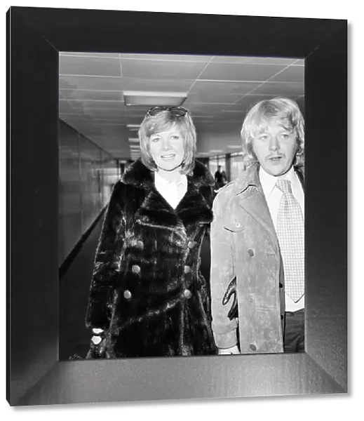 Singer Cilla Black pictured at Heathrow airport with her husband Bobby