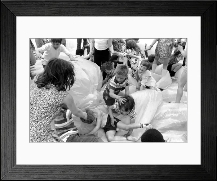 Framed Print : Kids in the Park: It was shoes off in Tabbard Gardens, Bermondsey, today (Saturday)