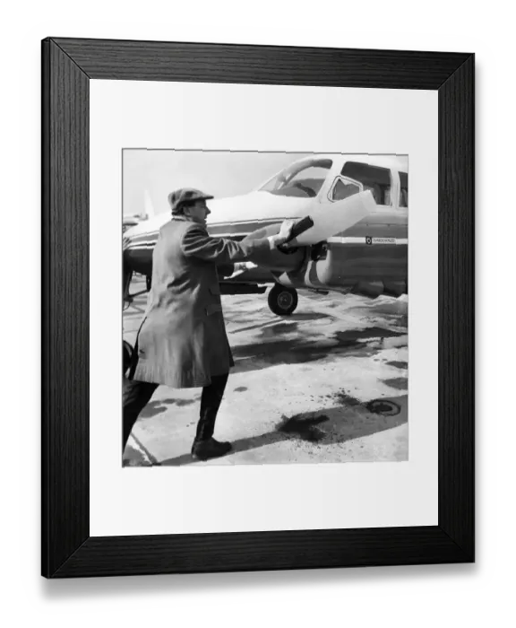 Framed Print : Managing Director Freddie Laker (40) pushes his own aircraft back off the airfield apron Framed Print : Managing Director Freddie Laker (40) pushes his own aircraft back off the airfield apron
