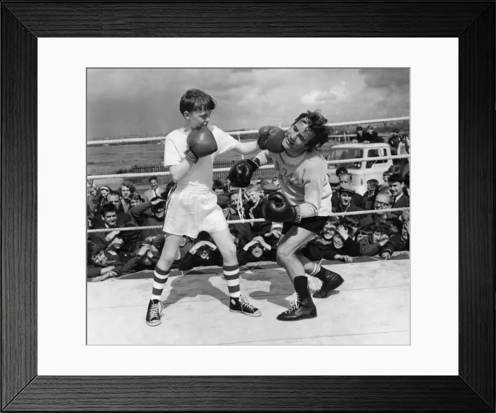 Framed Print : Boxer: Walter Mcgowan seen here in the ring during a training bout with a young admirer