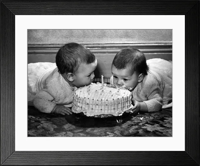 Framed Print : Pamela (left) and Suzanne Nicholson tuck into their first birthday cake. P007068 Framed Print : Pamela (left) and Suzanne Nicholson tuck into their first birthday cake. P007068