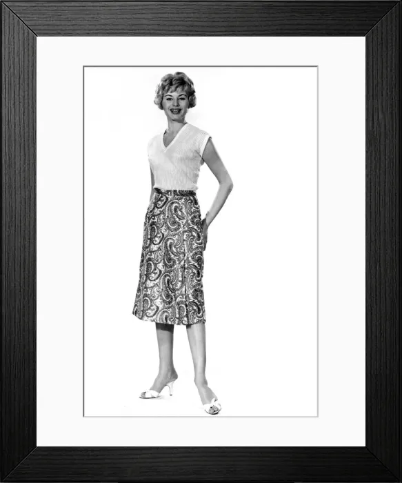 Framed Print : Reveille Fashions. Margaret Lorraine modelling a knee length paisley pattern skirt Framed Print : Reveille Fashions. Margaret Lorraine modelling a knee length paisley pattern skirt