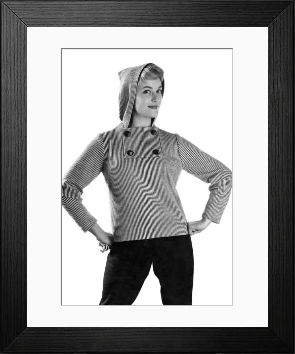 Framed Print : Reveille Fashions: Button up the cold, model wearing hooded jumper. January 1959 P006939 Framed Print : Reveille Fashions: Button up the cold, model wearing hooded jumper. January 1959 P006939