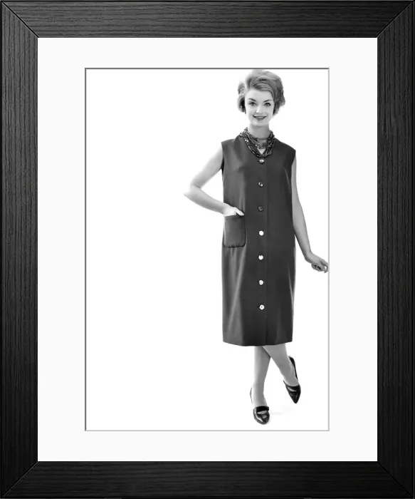 Framed Print : Reveille Fashions: Model wearing sleeveless summer dress. March 1959 P006927