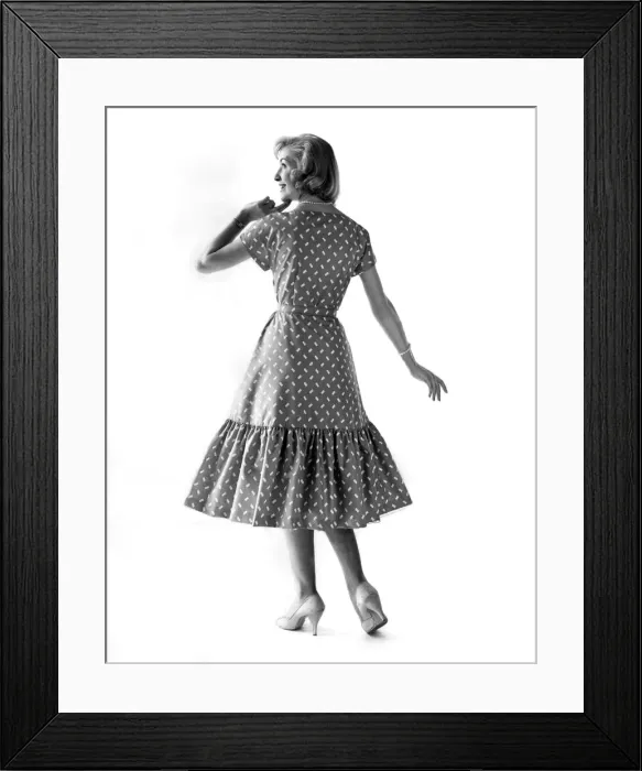 Framed Print : Clothing Fashion 1958. Audry Wayne modelling a pattern dress with frill skirt Framed Print : Clothing Fashion 1958. Audry Wayne modelling a pattern dress with frill skirt