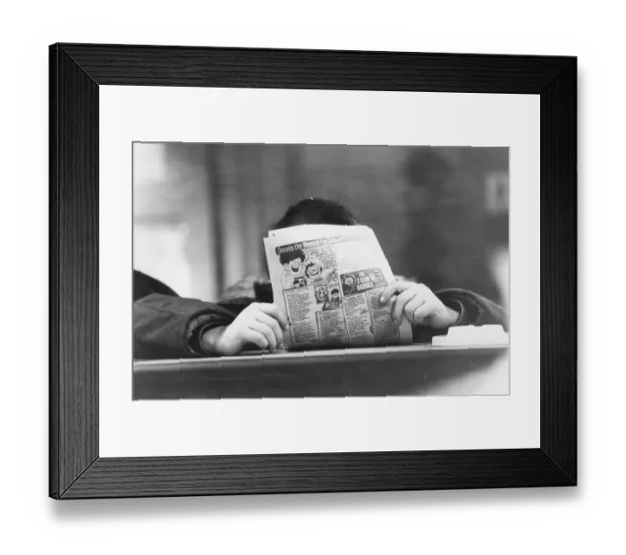 Framed Print : Teenagers enjoy the social side of a Youth Club, chatting and reading