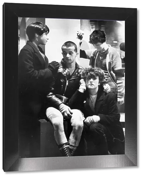 Teenagers hang about, bored, in Eldon Square, Newcastle
