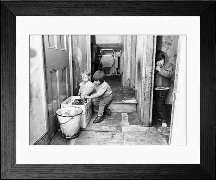 Framed Print : The Interior of slum housing in an area of Newcastle - Children finding anythig to play Framed Print : The Interior of slum housing in an area of Newcastle - Children finding anythig to play