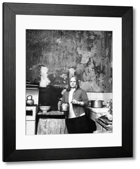 Framed Print : The Interior of slum housing in an area of Newcastle - Mrs Campbel in her kitchen where